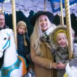 smiling-family-on-merry-go-round_925x