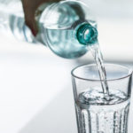 pouring-water-from-pet-bottle-into-a-glass-picjumbo-com