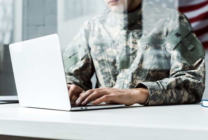 military personnel with computer